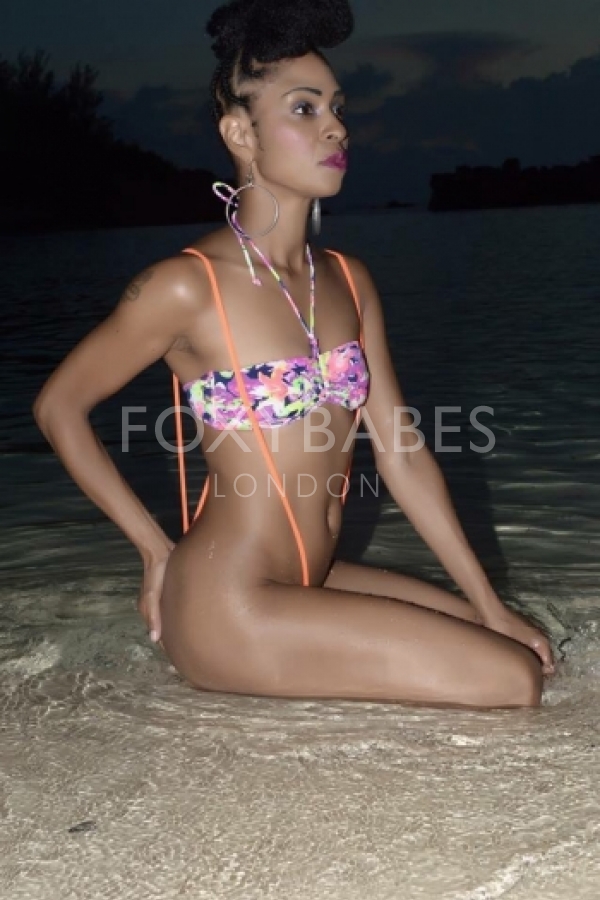 Toya sat on beach in bikini 